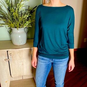 The Limited Slit-Arm 3/4 Sleeve Top